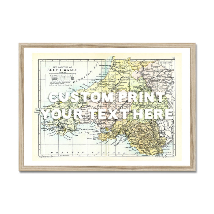A framed vintage map print of South Wales with a white hand-drawn font, labeled 'CUSTOM TEXT HERE'.