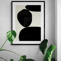 Balancing Stones No 3 (Abstract Wall Art) shown in black frame with house plants - Beach House Art