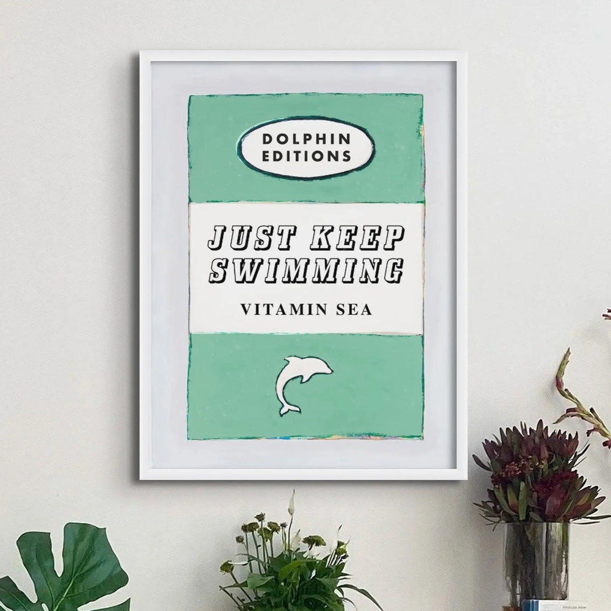 ramed book cover poster with white frame - Just keep swimmong is written in large font in the centre and is perfect for wild swimmers or cold water swimming enthusiasts