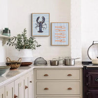 set of two kitchen wall art prints of shellfish paintings in a country kitchen - beach house art