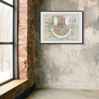 vintage map of London with a white smiley face on it in a black frame on a rustic wall - beach house art