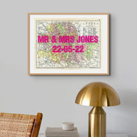 Coastal wall art featuring a personalised vintage city map print of London with navy font - Framed