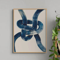 Framed abstract art print of a nautical knot in blue - coastal wall art