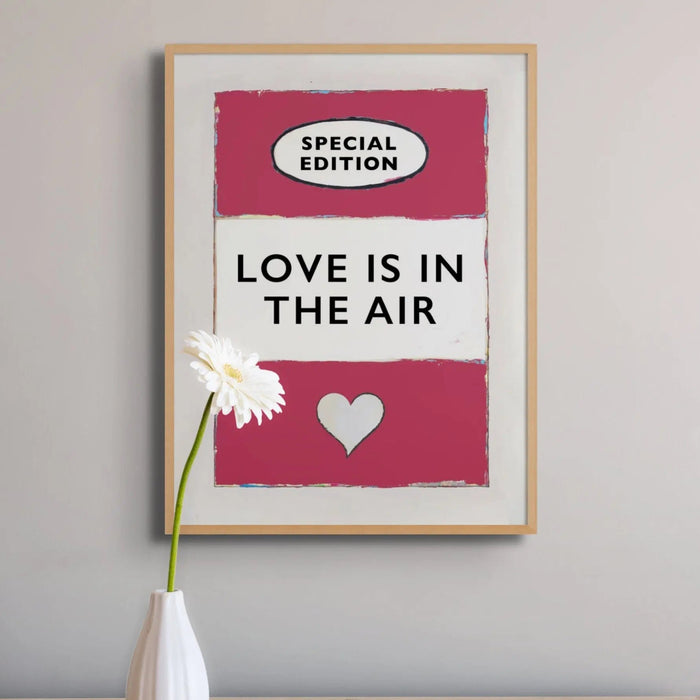 framed print of the Vintage Book Cover for "Love is in the Air" song lyric art print in red (Viva Magenta) - Framed Wall Art
