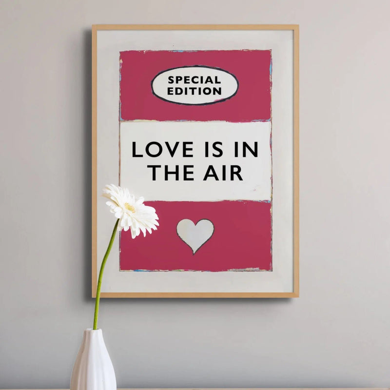 framed print of the Vintage Book Cover for "Love is in the Air" song lyric art print in red (Viva Magenta) - Framed Wall Art