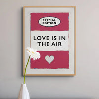 framed print of the Vintage Book Cover for "Love is in the Air" song lyric art print in red (Viva Magenta) - Framed Wall Art