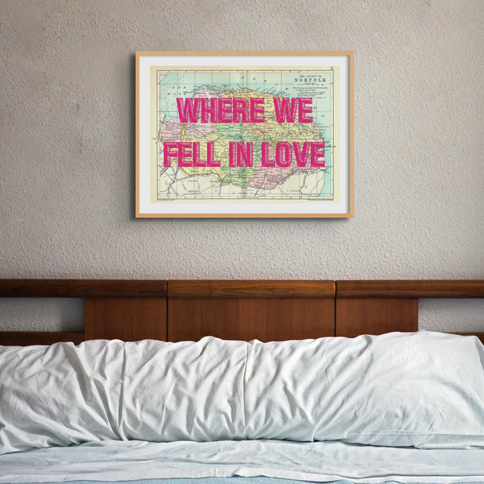 Coastal wall art featuring a personalised vintage map print of Norfolk with pink font - framed wall art