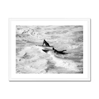 black & white photograph of two surfers in the surf in a white frame - beach house art
