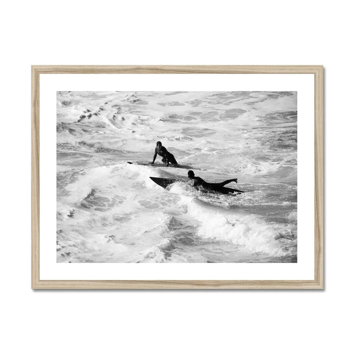 black & white photograph of two surfers in the surf in a natural frame - beach house art
