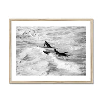 black & white photograph of two surfers in the surf in a natural frame - beach house art