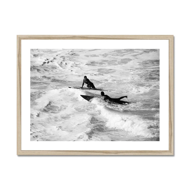 black & white photograph of two surfers in the surf in a natural frame - beach house art