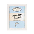 A vintage book art print with the title 'Paradise Found' by Dolphin Editions. The artwork features a simple, clean design with typography and a small graphic of a dolphin.