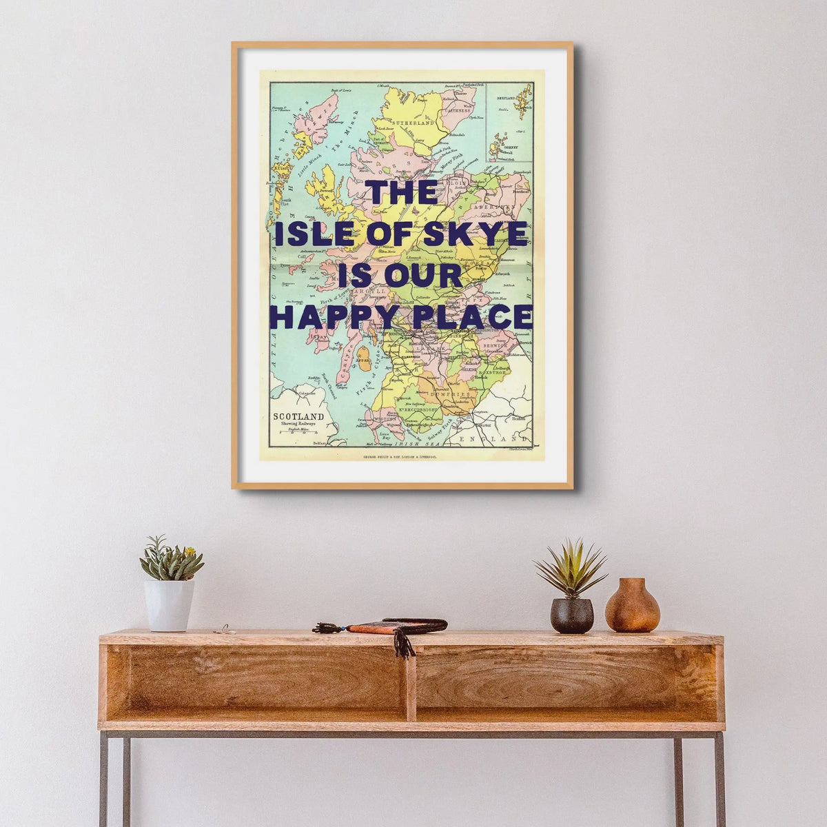 Coastal wall art featuring a personalised vintage map print of Scotland with navy font - Framed wall art