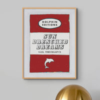 beautiful vintage book cover art print titled "Sun Drenched Dreams" in red. It's framed and would make a lovely addition to any space.