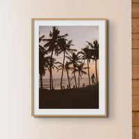 Photograph of palm tree silhouettes against a beach sunset in a natural frame - beach house art