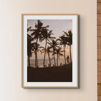 coloured photograph of palm trees silhouette against a beach sunset in a retro bedroom - beach house art